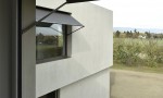 Villa contemporaine moderne à Founex villa béton Counson architectes Kästli stores